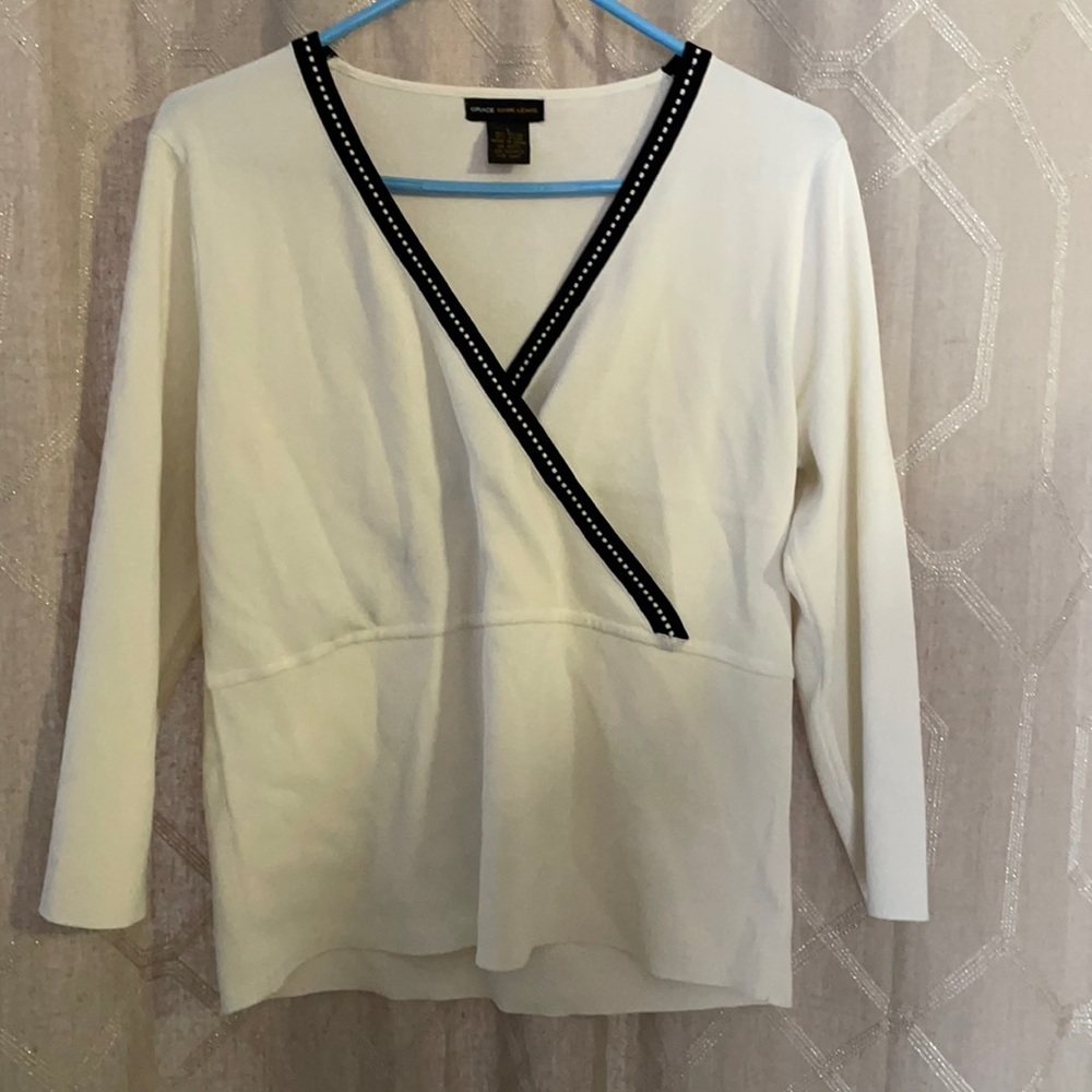 White wrap shirt with black trim